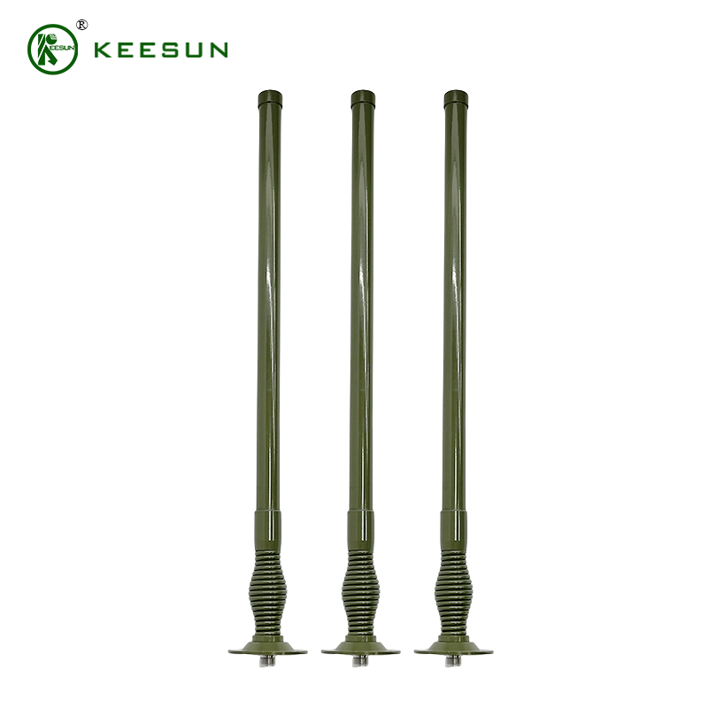 Three olive-drab, rod-shaped radio antennas with a corrugated base stand upright against a white background. 